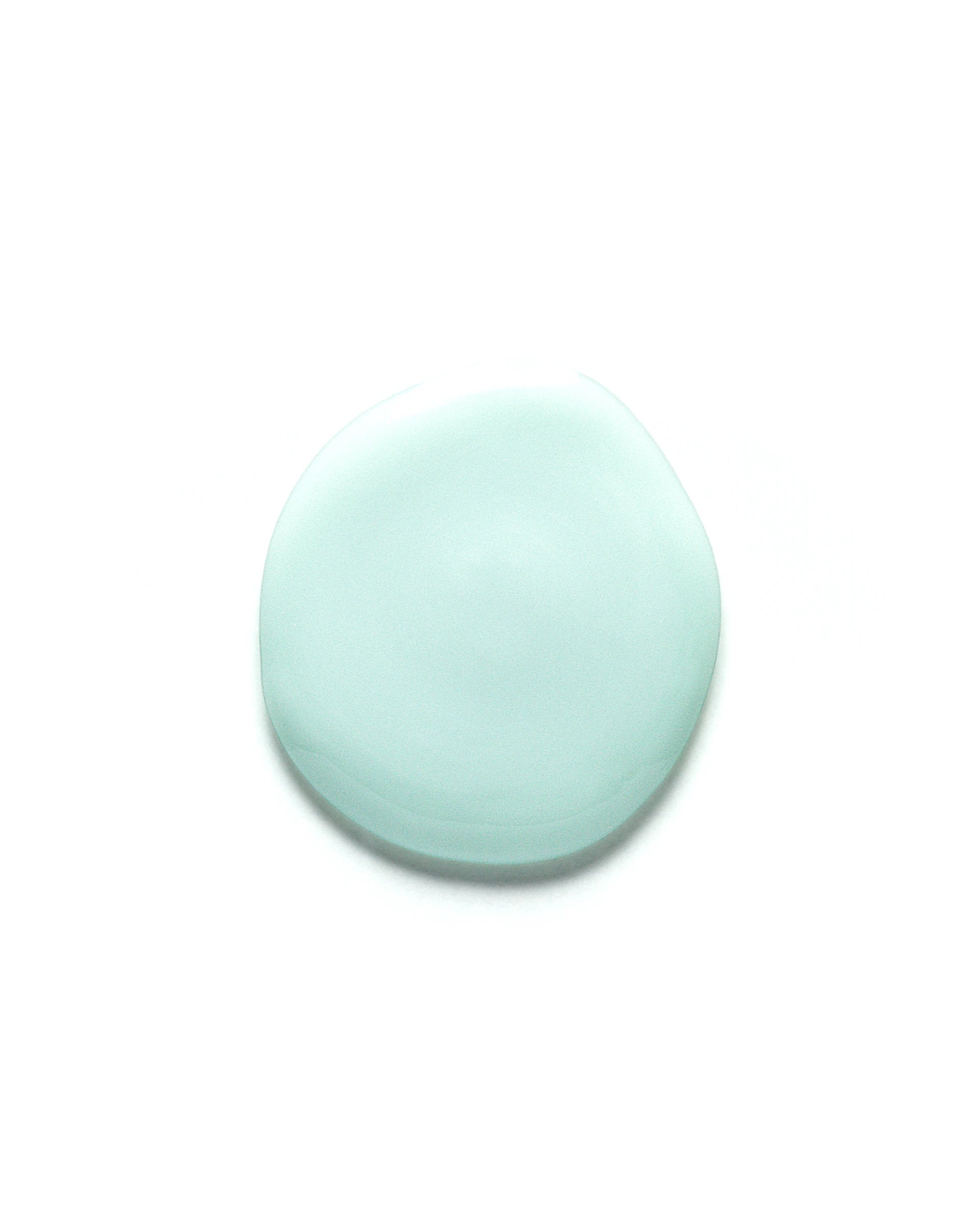 Light blue droplet of Blue Agave Fortifying Face Serum on a clean white background. The serum has a smooth, creamy texture, highlighting its hydrating and skin-replenishing properties.