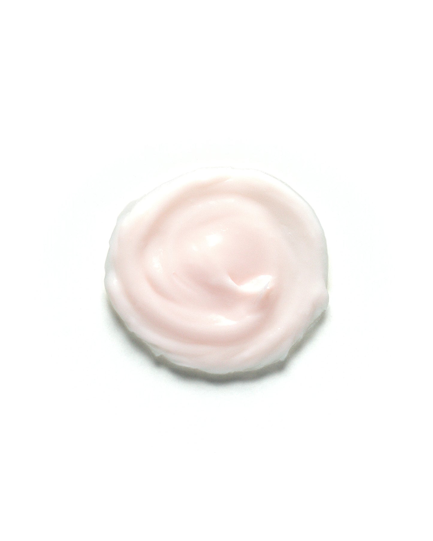 Soft pink swirl of Desert Rose & Hibiscus Moisturizing Face Cream on a white background. The rich, creamy texture highlights its nourishing and hydrating properties. Skincare product formulated to soothe, and moisturize dry or sensitive skin.